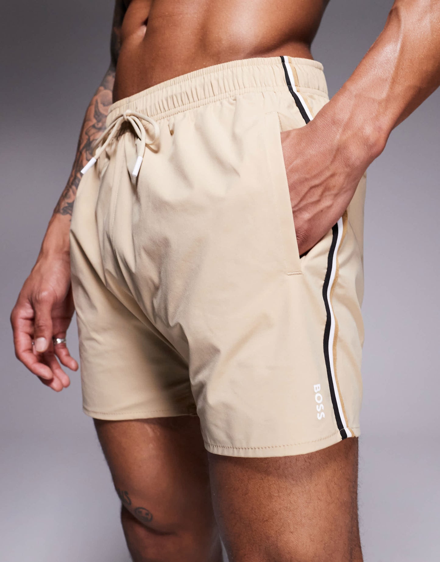 BOSS Iconic side stripe logo swim shorts  in light beige