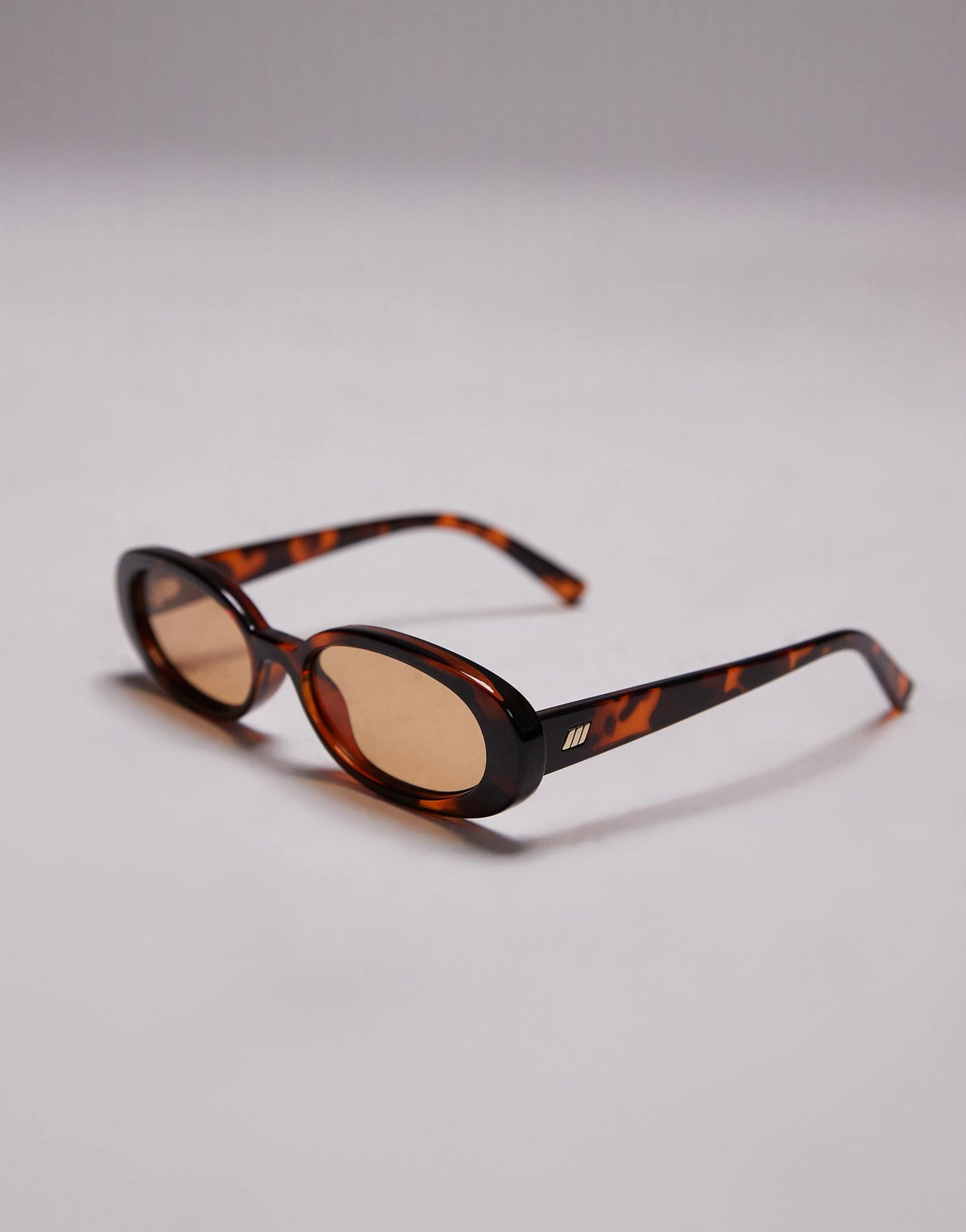 Le Specs outta love oval sunglasses in tortoiseshell with amber lens