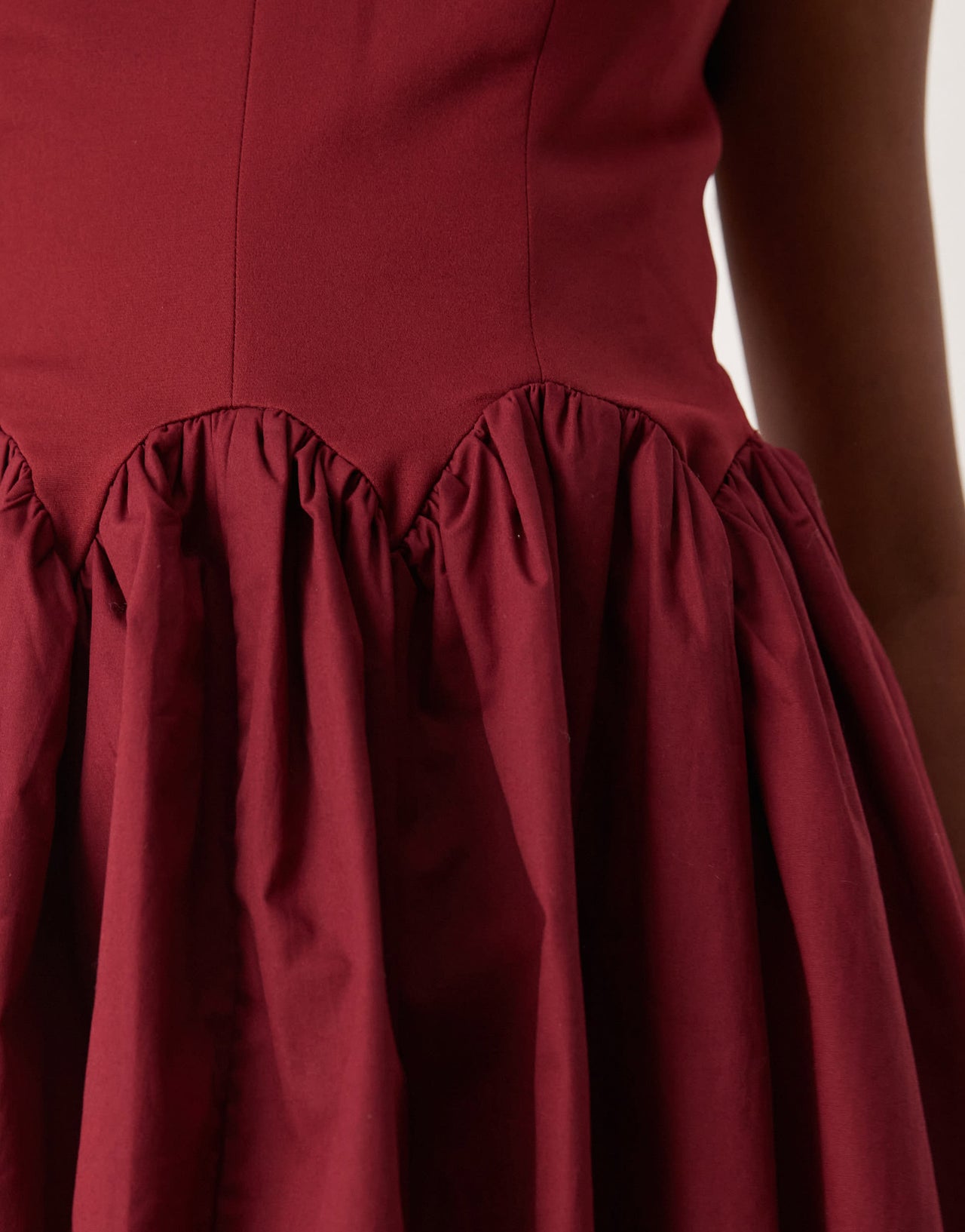 Never Fully Dressed drop hem mini dress in burgundy