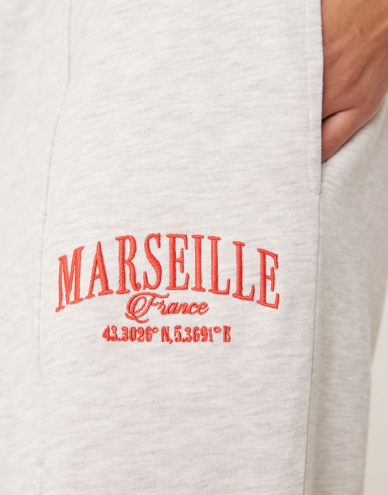 ASOS DESIGN straight leg jogger with Marseille embroidered graphic in ice marl