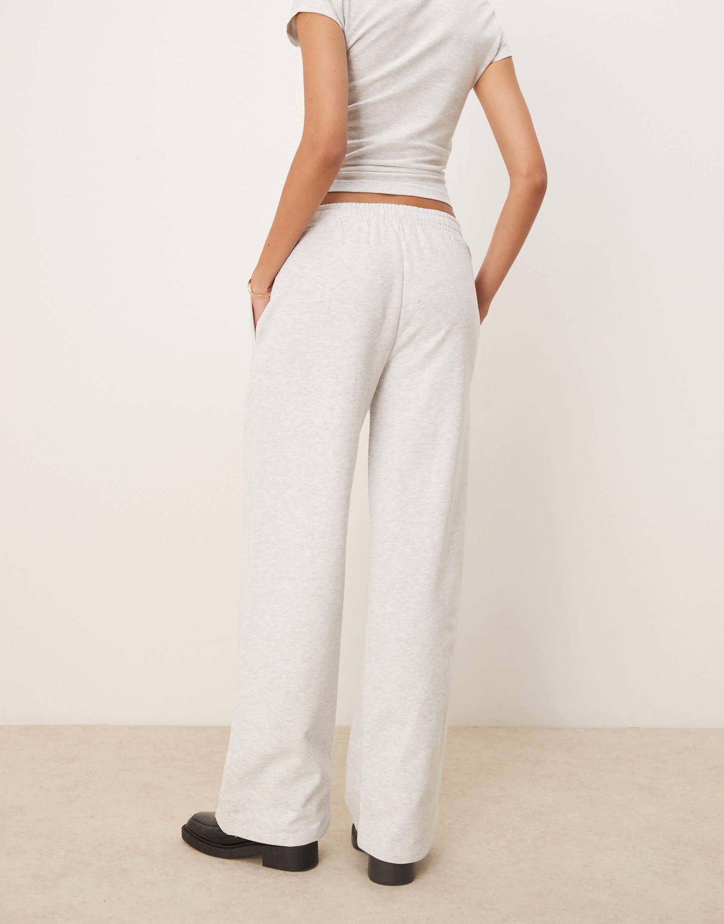ASOS DESIGN straight leg jogger with Marseille embroidered graphic in ice marl