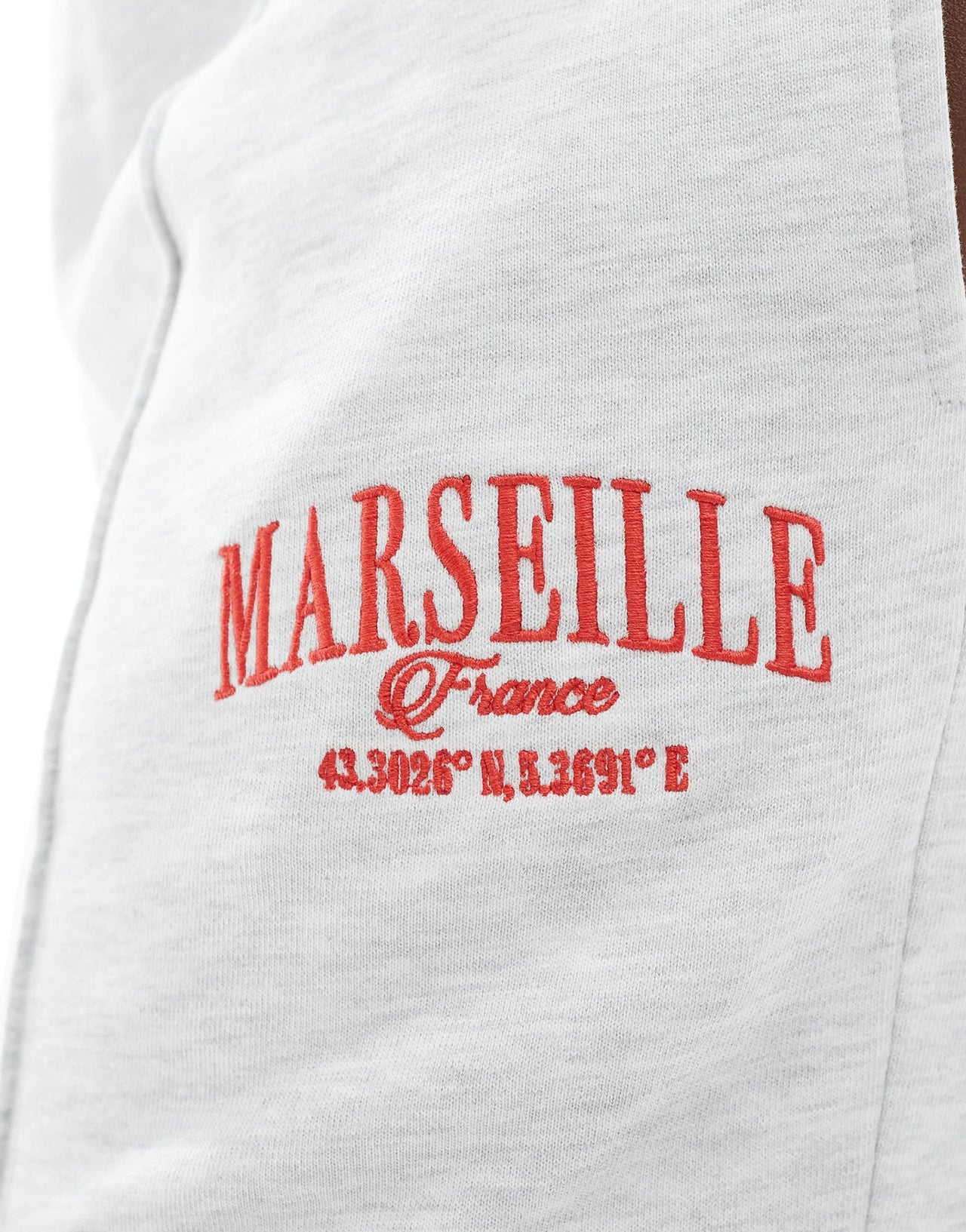 ASOS DESIGN Curve straight leg jogger with Marseille embroidered graphic in ice marl