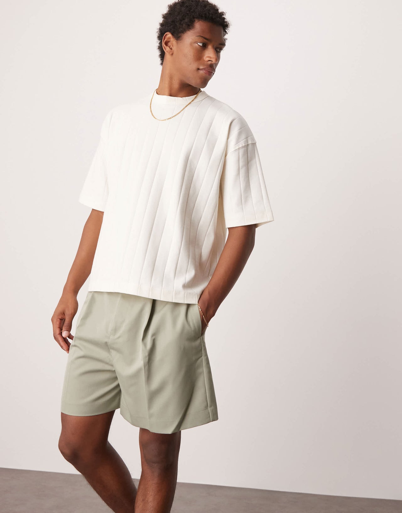 ASOS DESIGN smart bermuda shorts with front pleat and belt detail in green