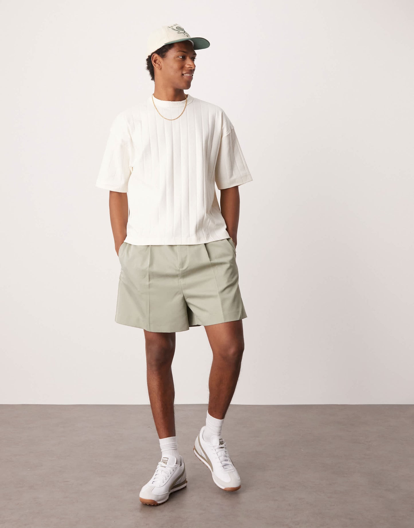 ASOS DESIGN smart bermuda shorts with front pleat and belt detail in green