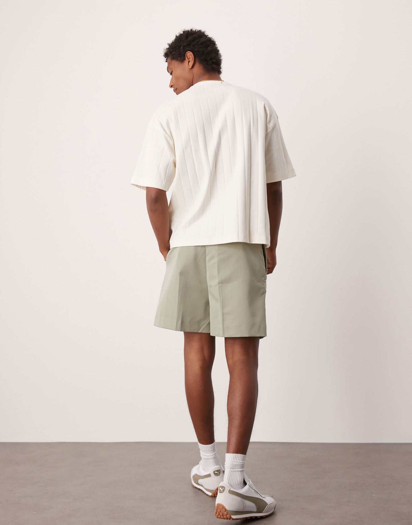 ASOS DESIGN smart bermuda shorts with front pleat and belt detail in green