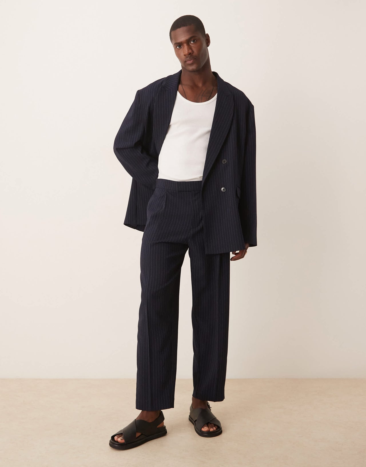 ASOS DESIGN oversized tapered suit trousers in navy&nbsp;pinstripe