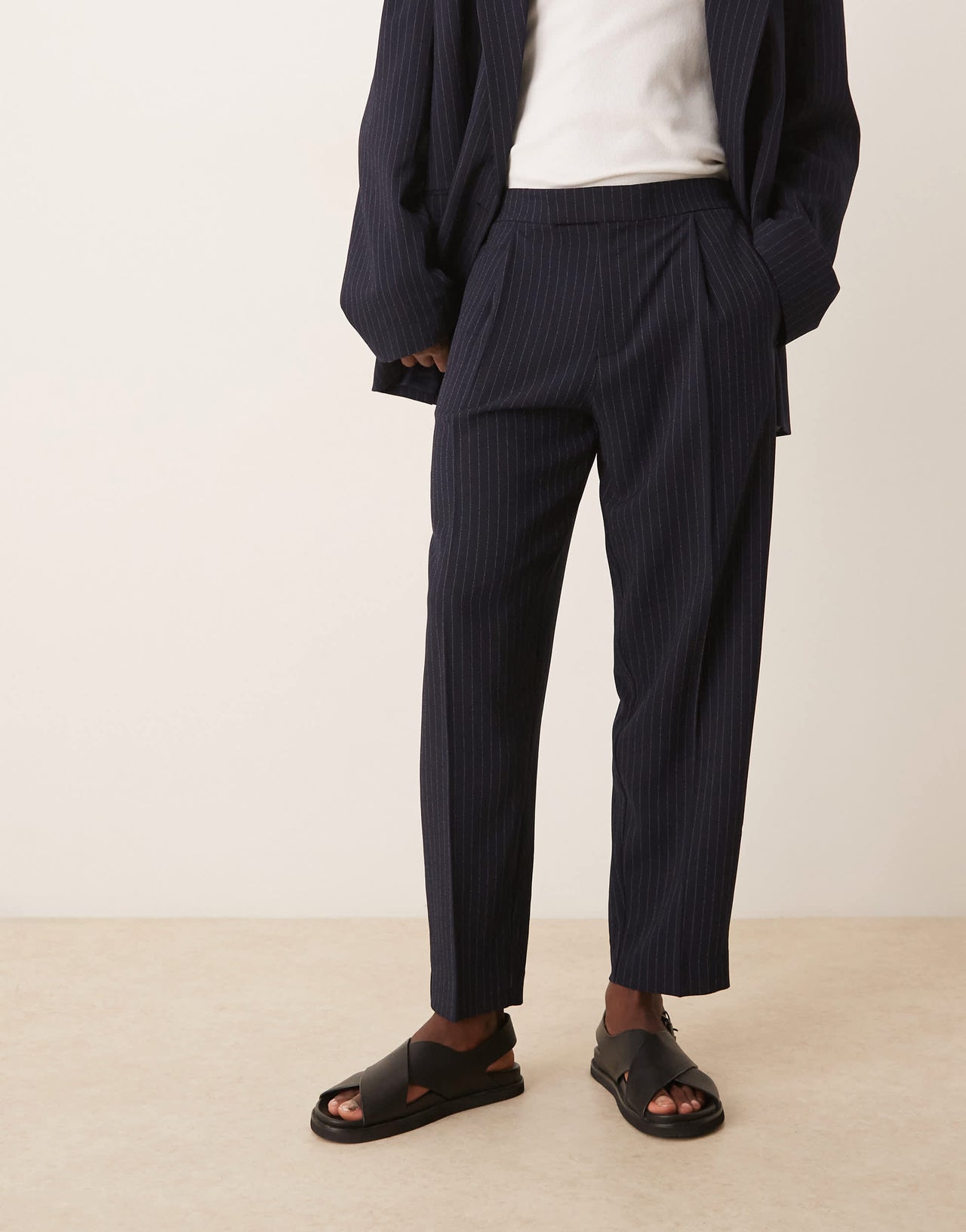 ASOS DESIGN oversized tapered suit trousers in navy&nbsp;pinstripe