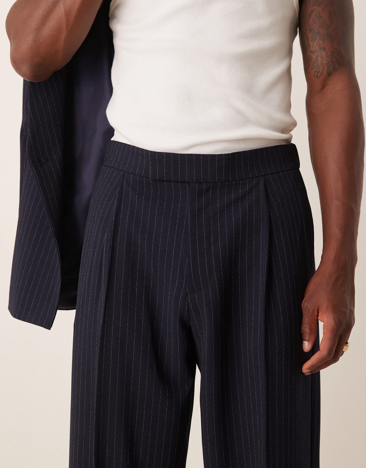 ASOS DESIGN oversized tapered suit trousers in navy&nbsp;pinstripe
