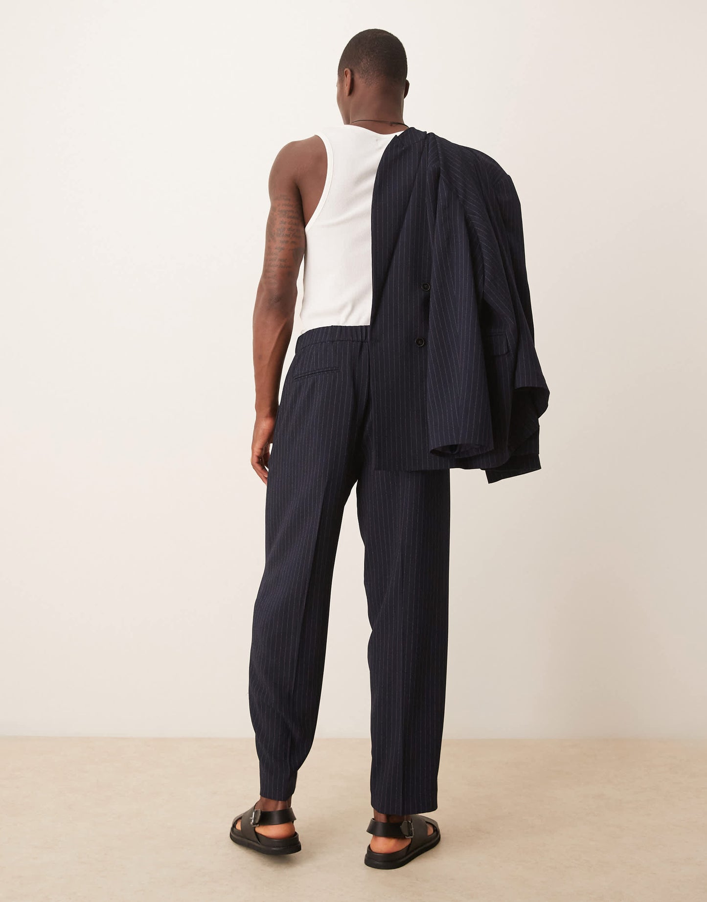 ASOS DESIGN oversized tapered suit trousers in navy&nbsp;pinstripe