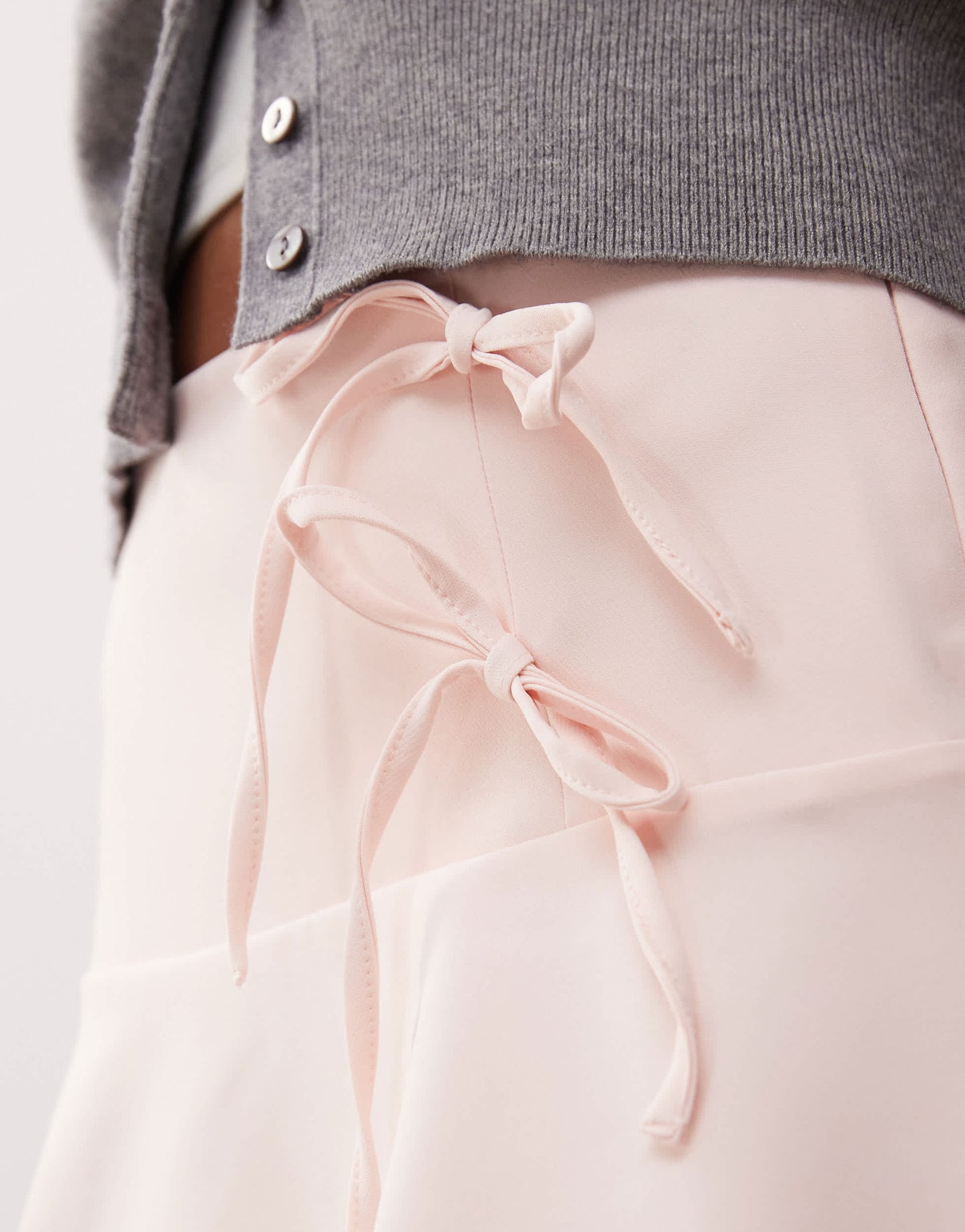 Miss Selfridge flippy mini skirt with bows in pink