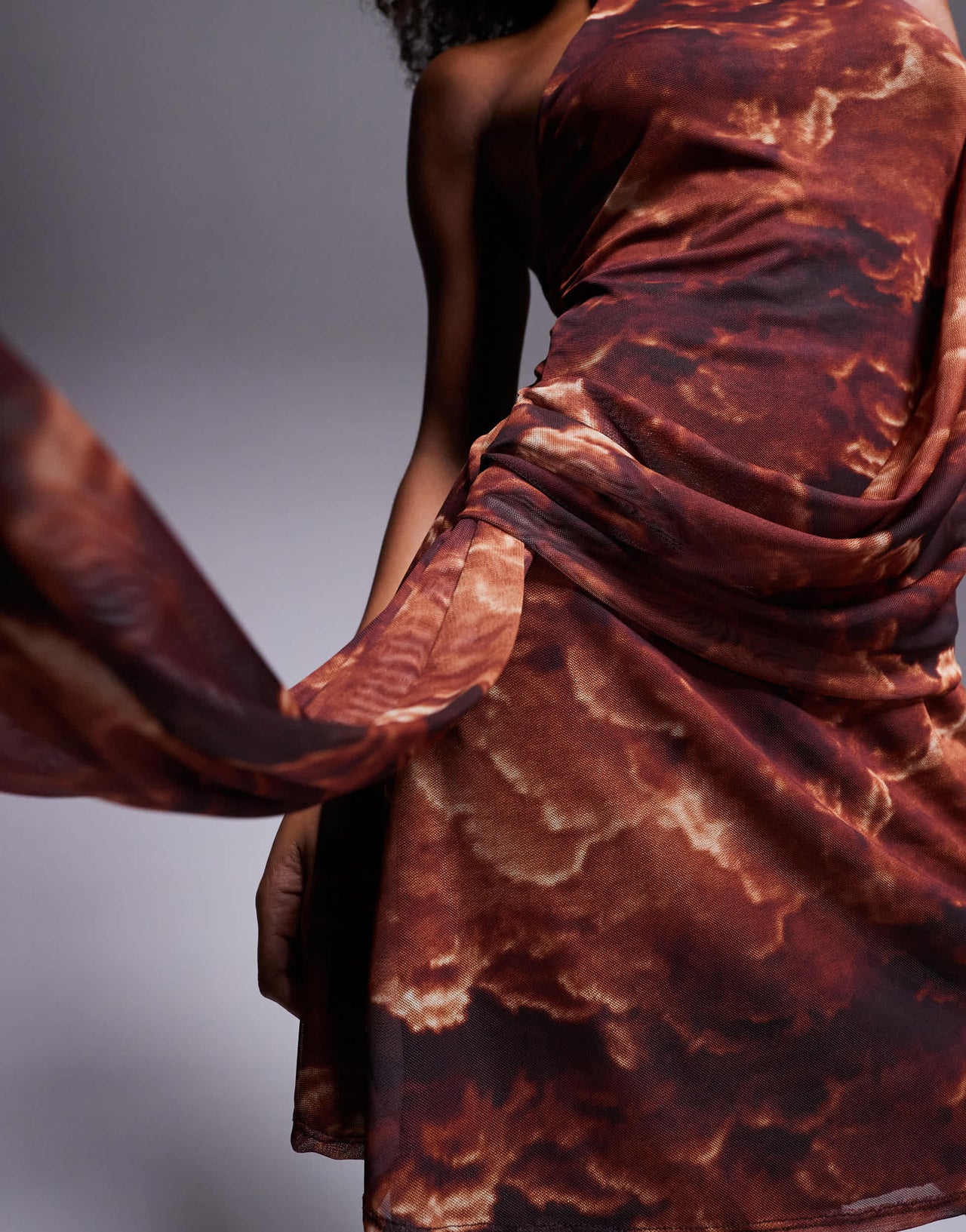 ASOS DESIGN mesh halterneck mini dress with drape sash detail in rust abstract print