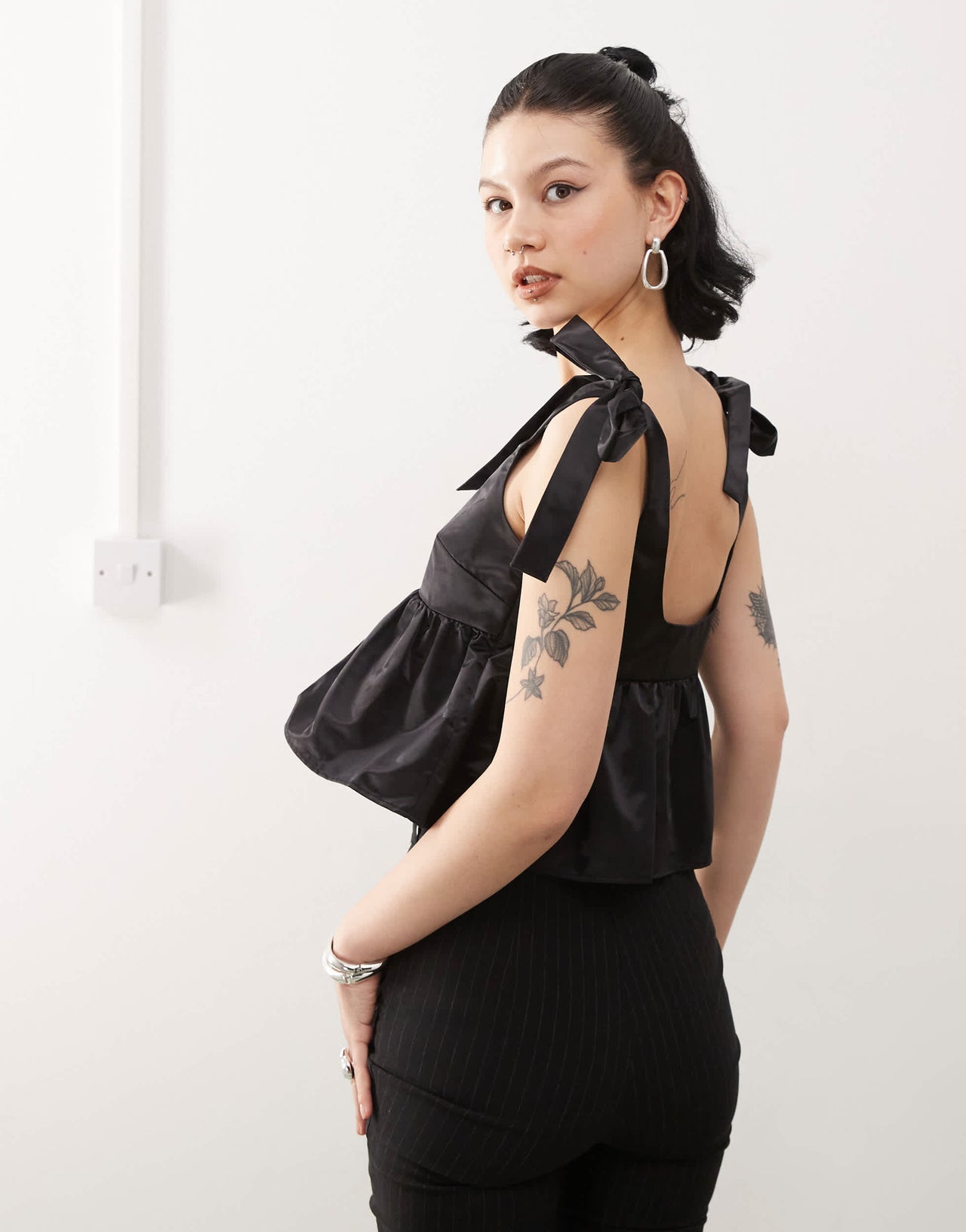 Monki satin peplum vest with bow strap detail in black