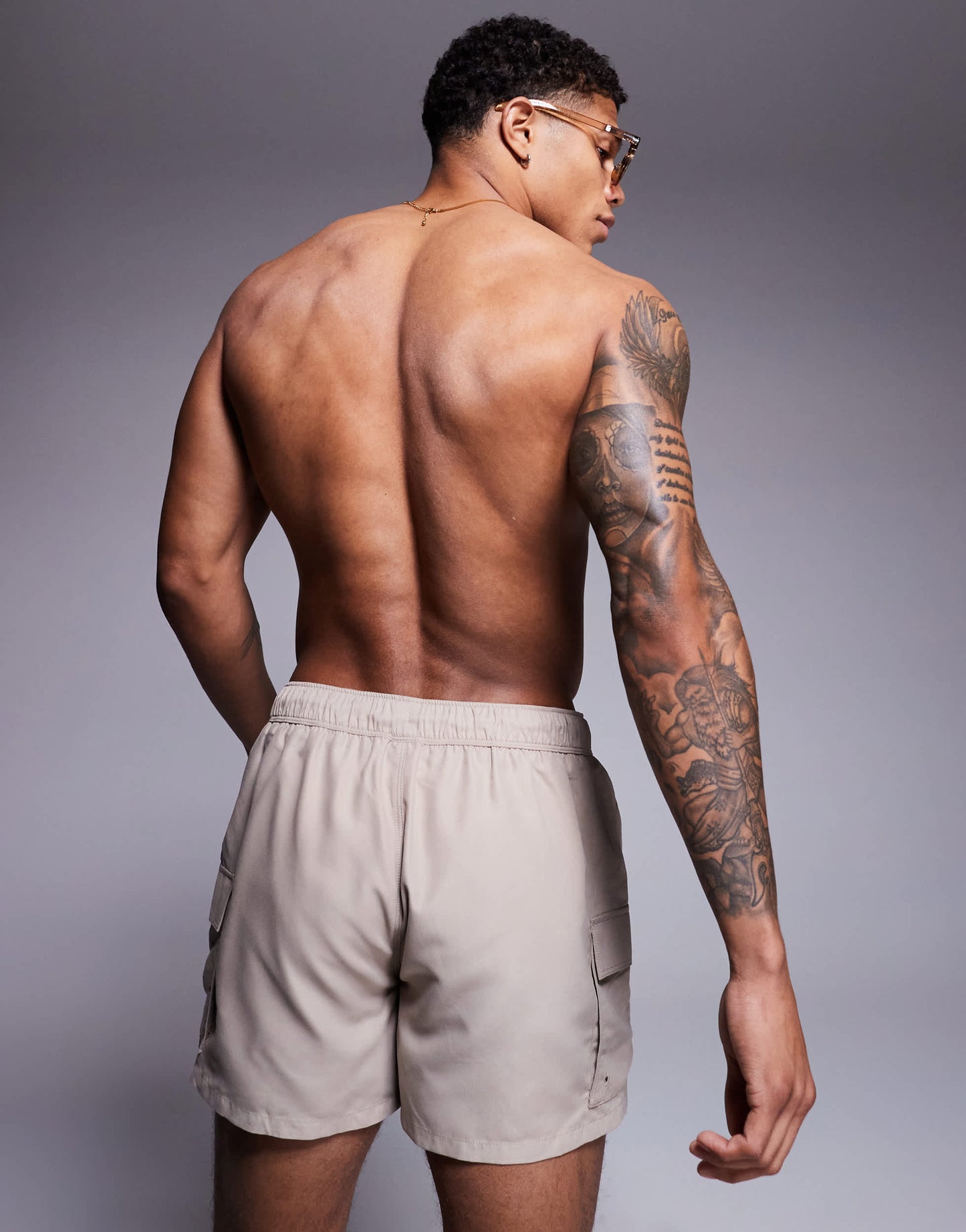 ASOS DESIGN swim shorts in short length with cargo pockets in stone
