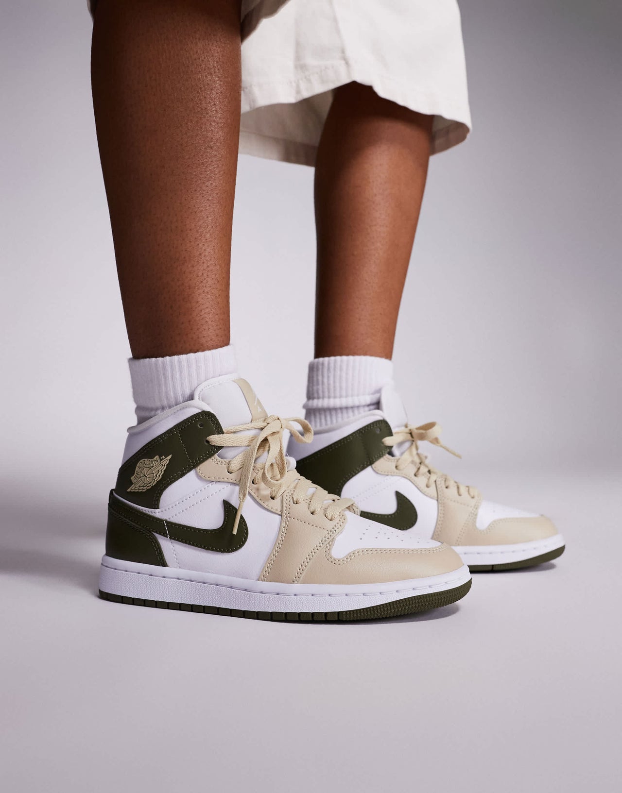 Nike Air Jordan 1 Mid trainers in white and khaki