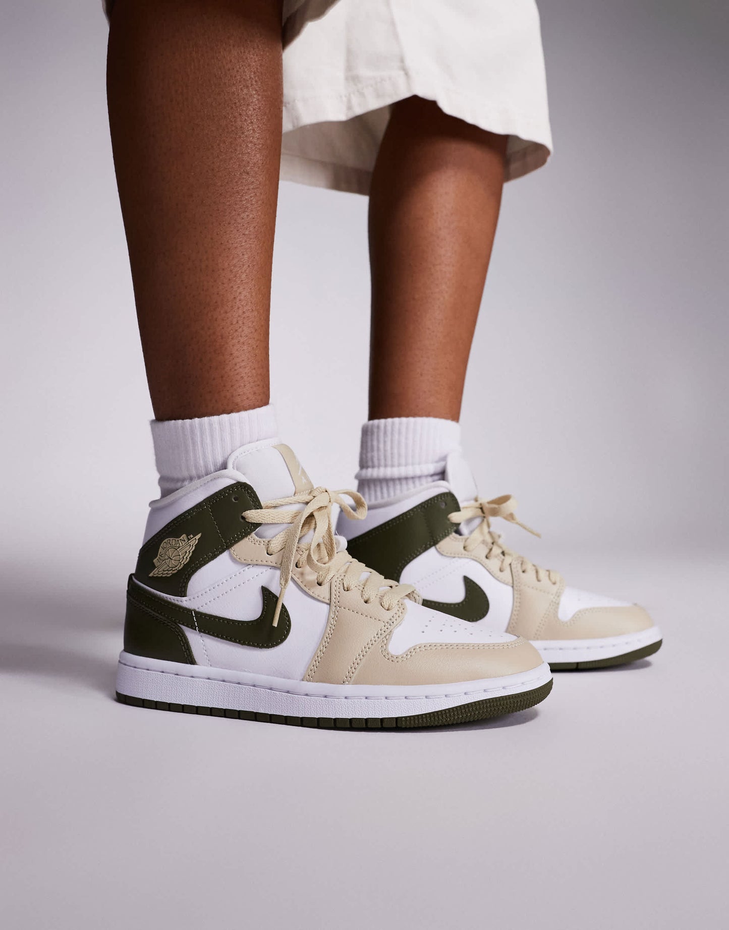 Nike Air Jordan 1 Mid trainers in white and khaki