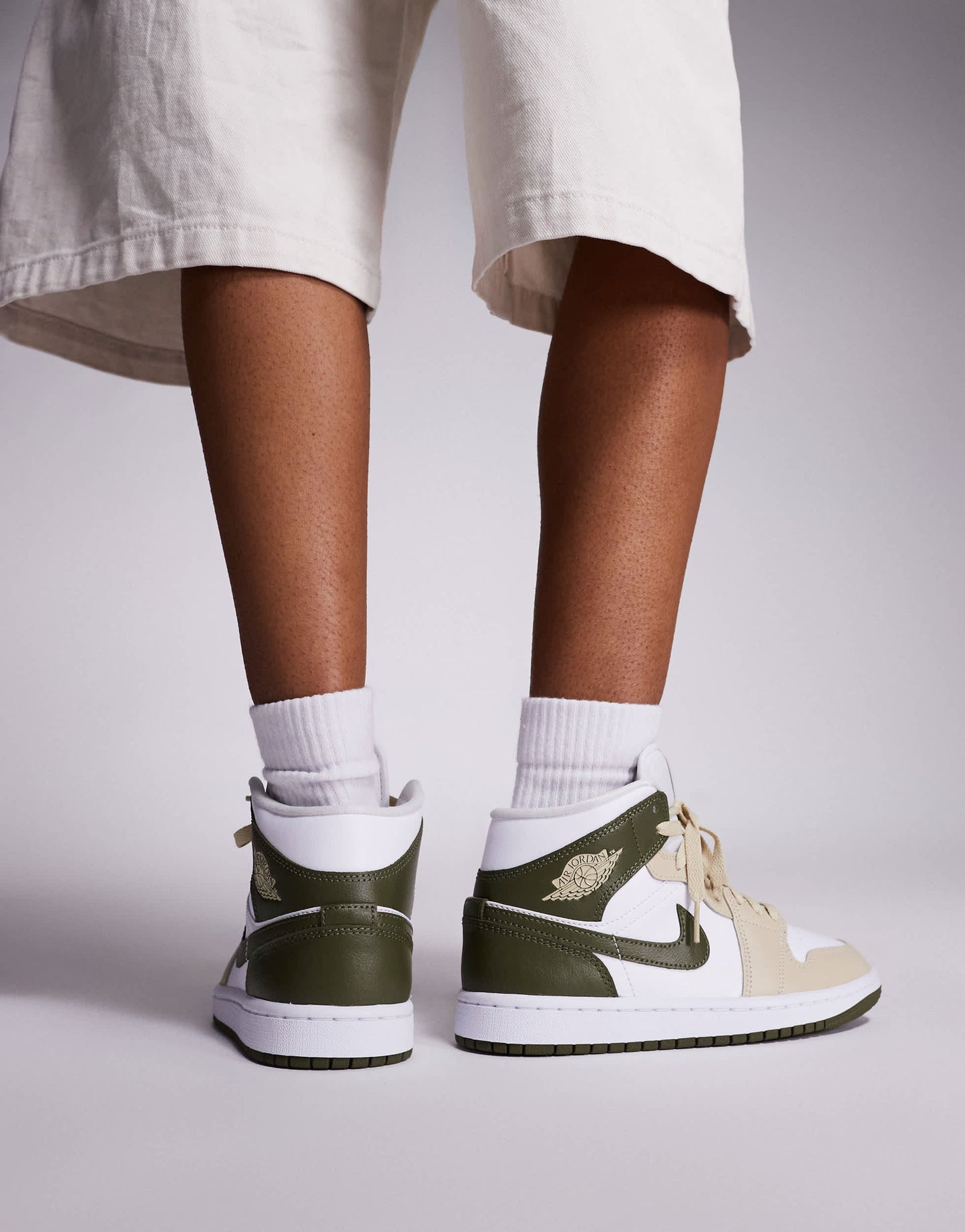 Nike Air Jordan 1 Mid trainers in white and khaki