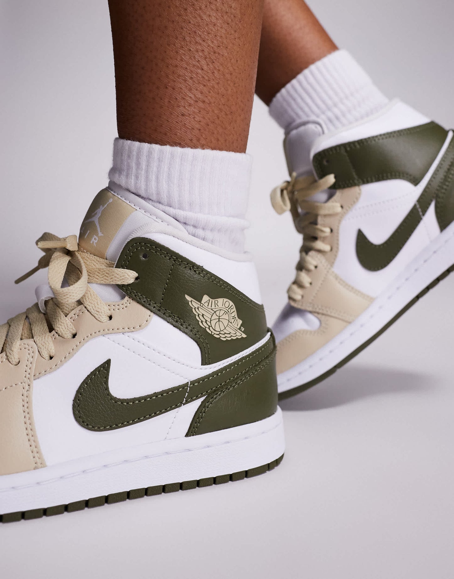 Nike Air Jordan 1 Mid trainers in white and khaki
