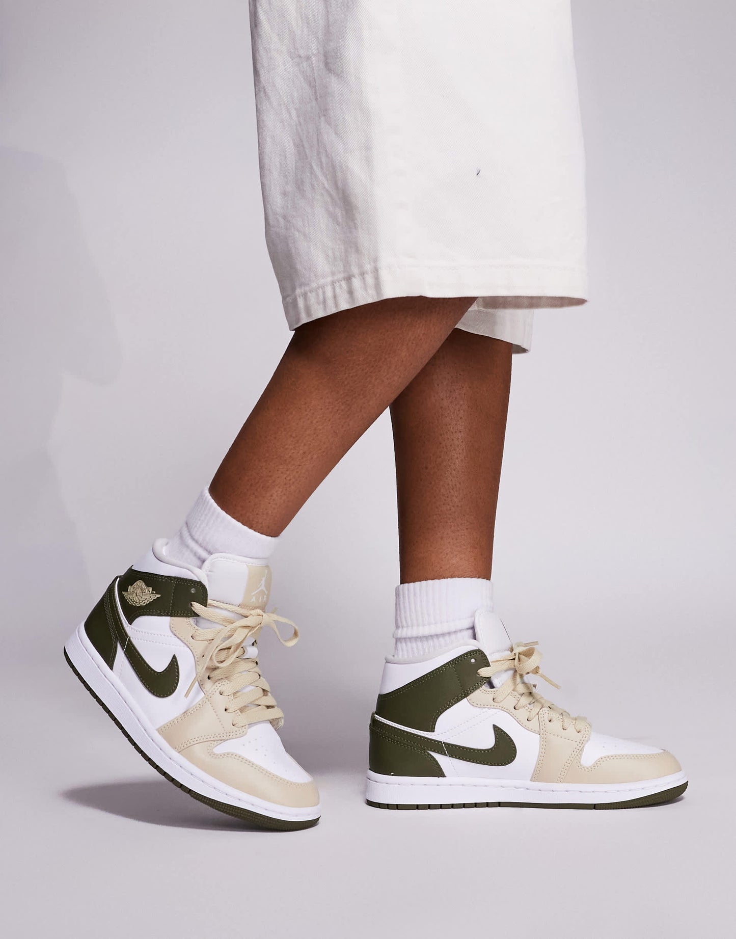 Nike Air Jordan 1 Mid trainers in white and khaki