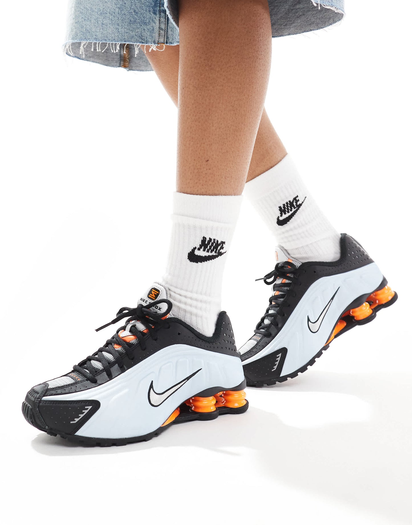 Nike Shox R4 trainers in black and metallic silver