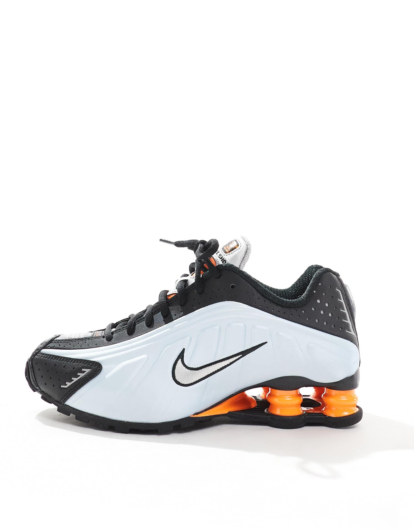 Nike Shox R4 trainers in black and metallic silver