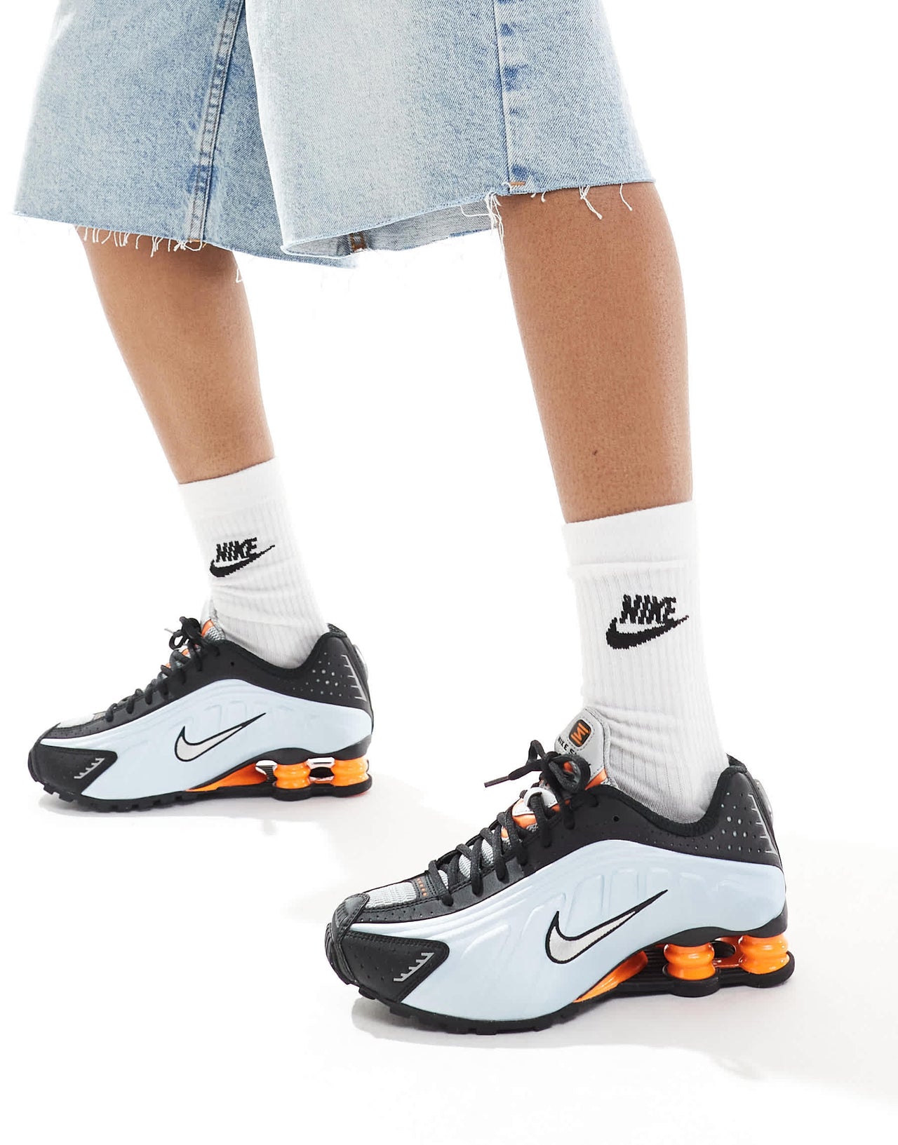 Nike Shox R4 trainers in black and metallic silver
