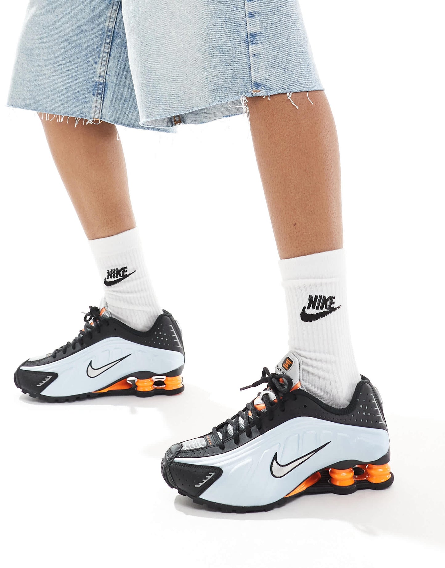 Nike Shox R4 trainers in black and metallic silver