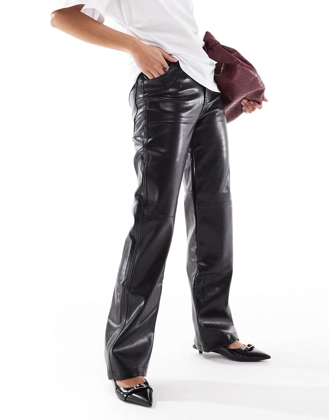 Bershka Petite straight leg faux leather trousers in black