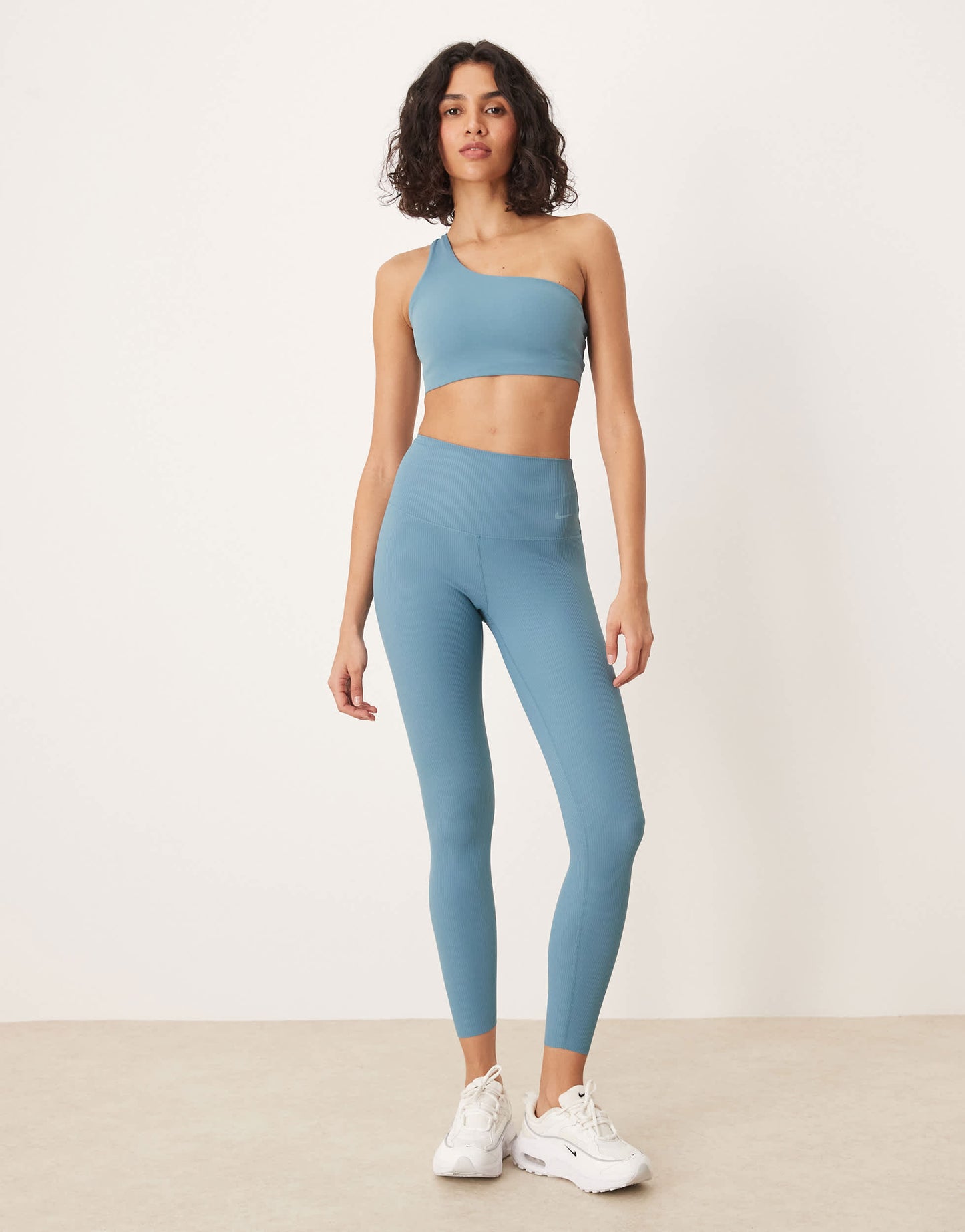 Nike Training Zenvy Dri-FIT soft touch asymmetric sports bra in blue