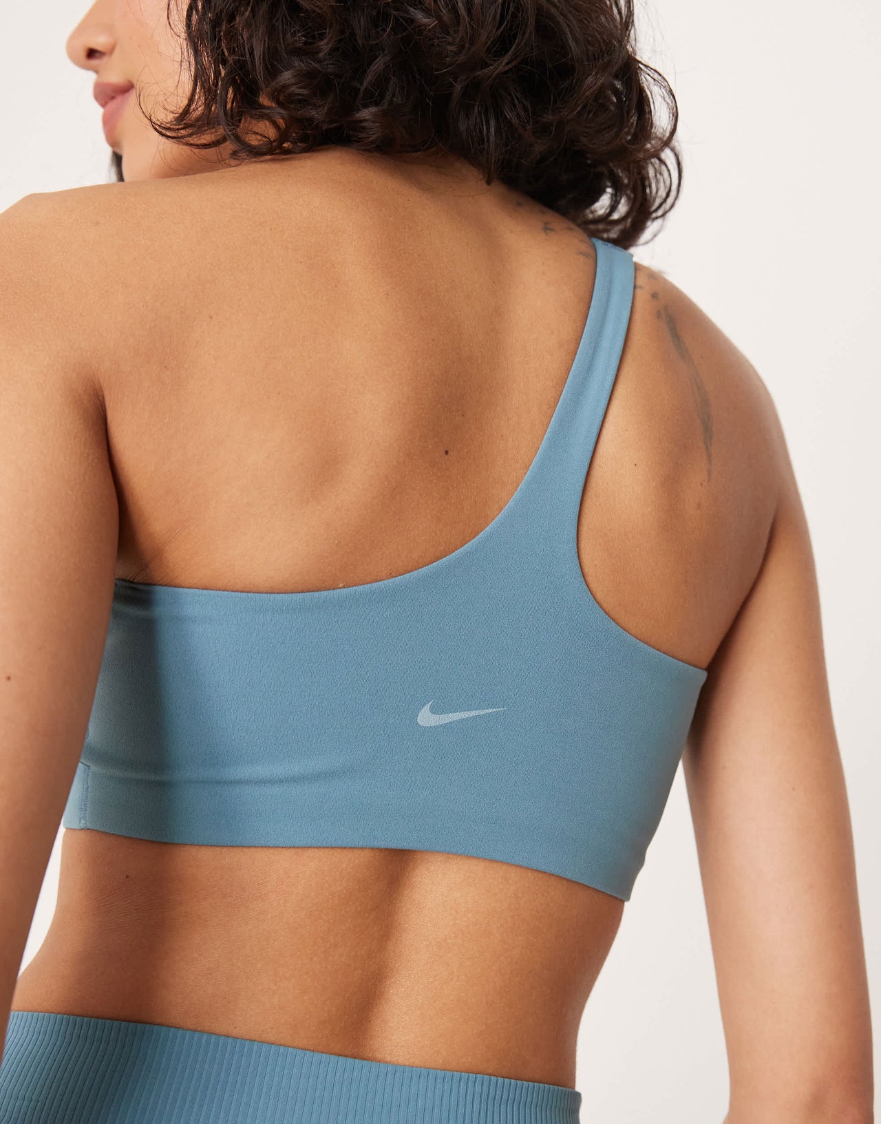 Nike Training Zenvy Dri-FIT soft touch asymmetric sports bra in blue