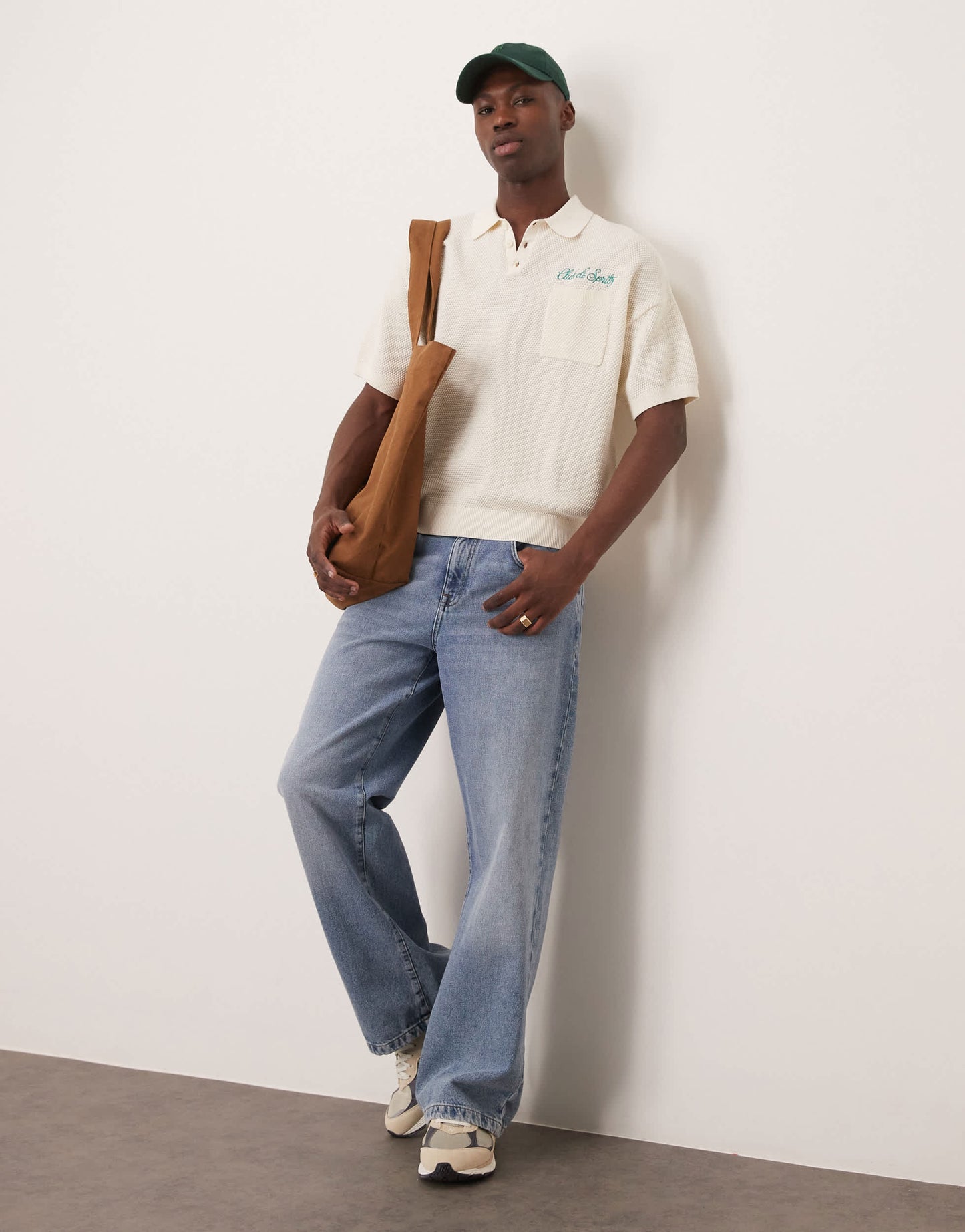 ASOS DESIGN relaxed knitted polo with chest pocket and embroidery text in ecru