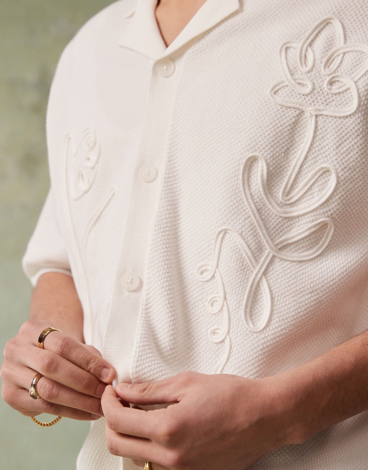ASOS DESIGN relaxed knitted button through polo with floral embroidery in ecru