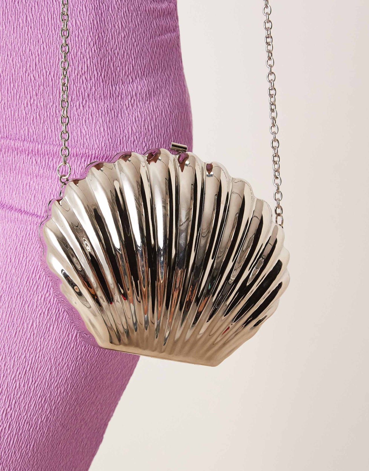 ASOS DESIGN shell metal clutch bag in silver with crossbody strap