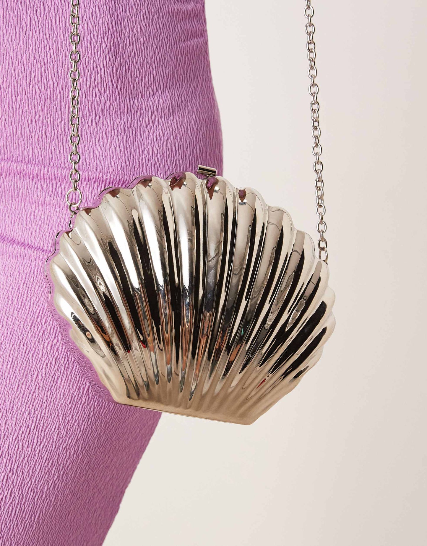 ASOS DESIGN shell metal clutch bag in silver with crossbody strap