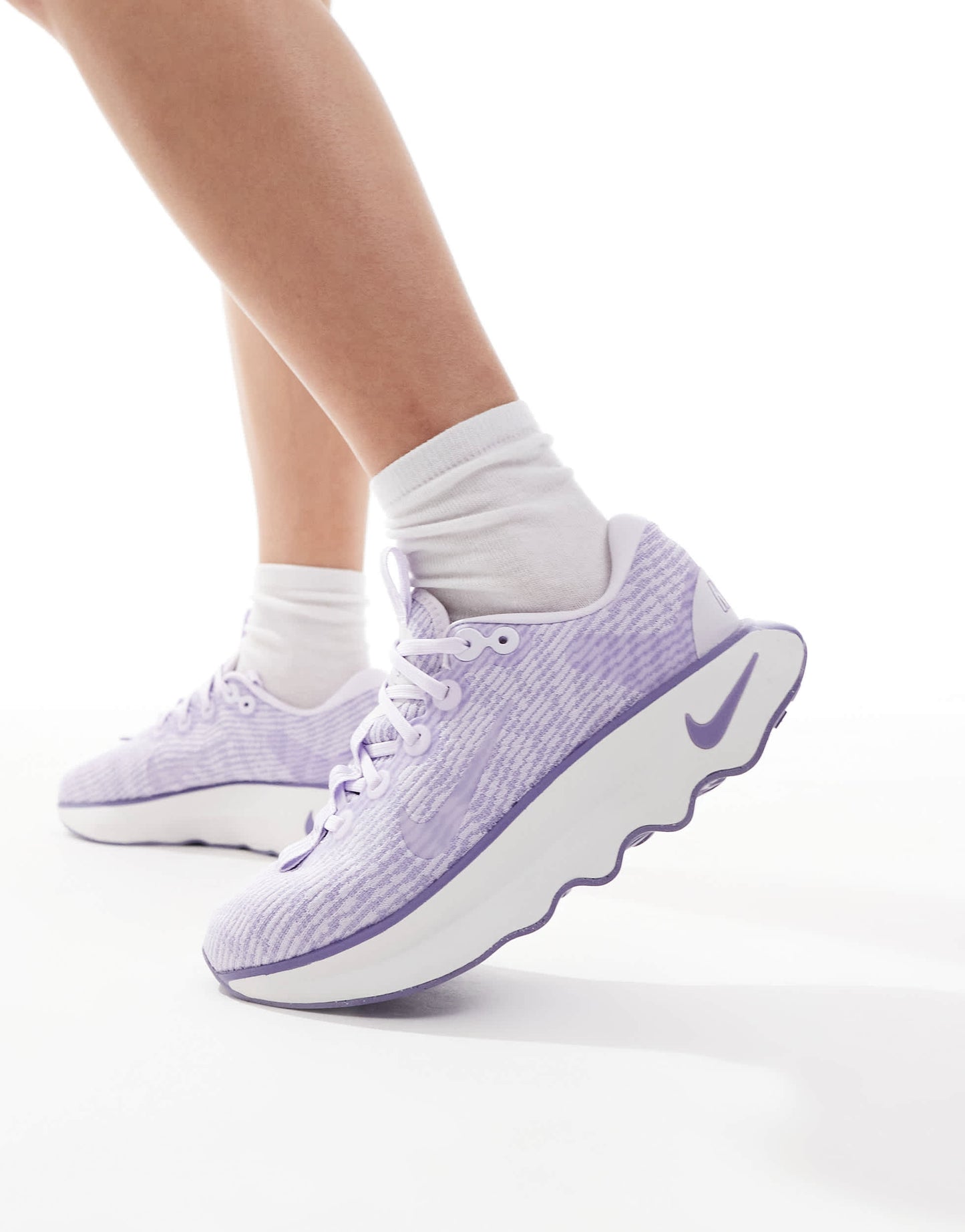 Nike Training Motiva trainers in lilac and white