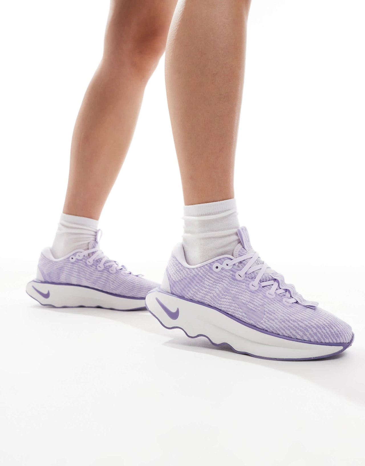 Nike Training Motiva trainers in lilac and white