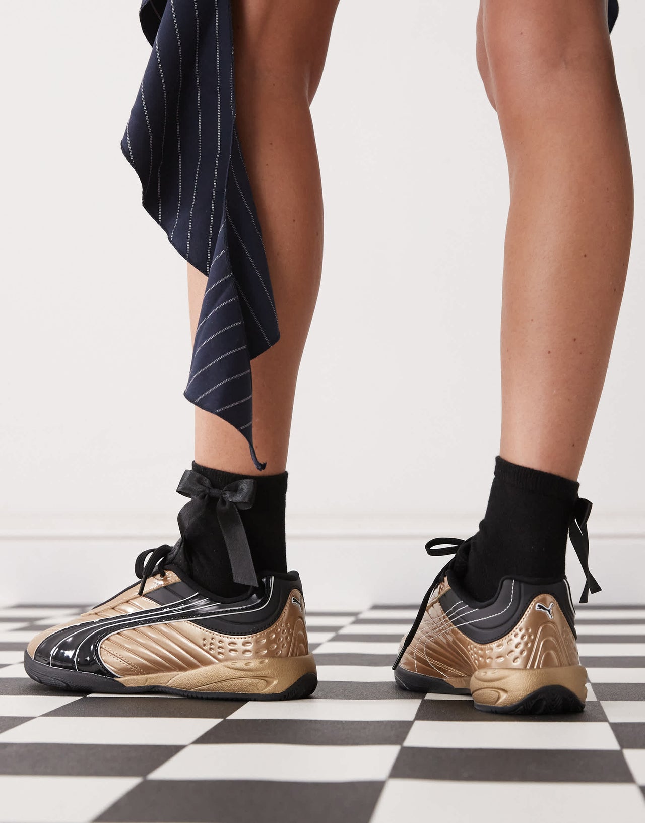Puma V1PER trainers in gold
