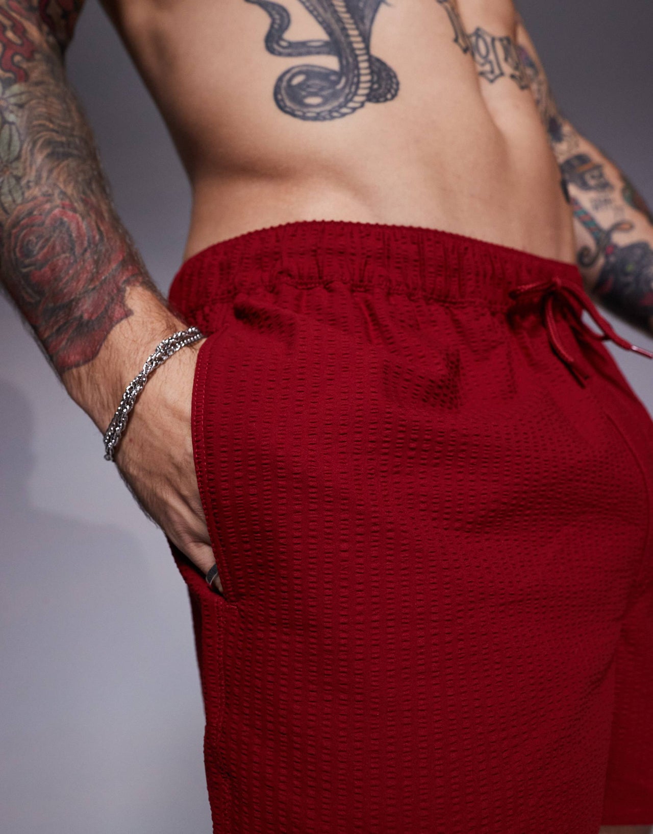 ASOS DESIGN seersucker swim shorts in short length in burgundy