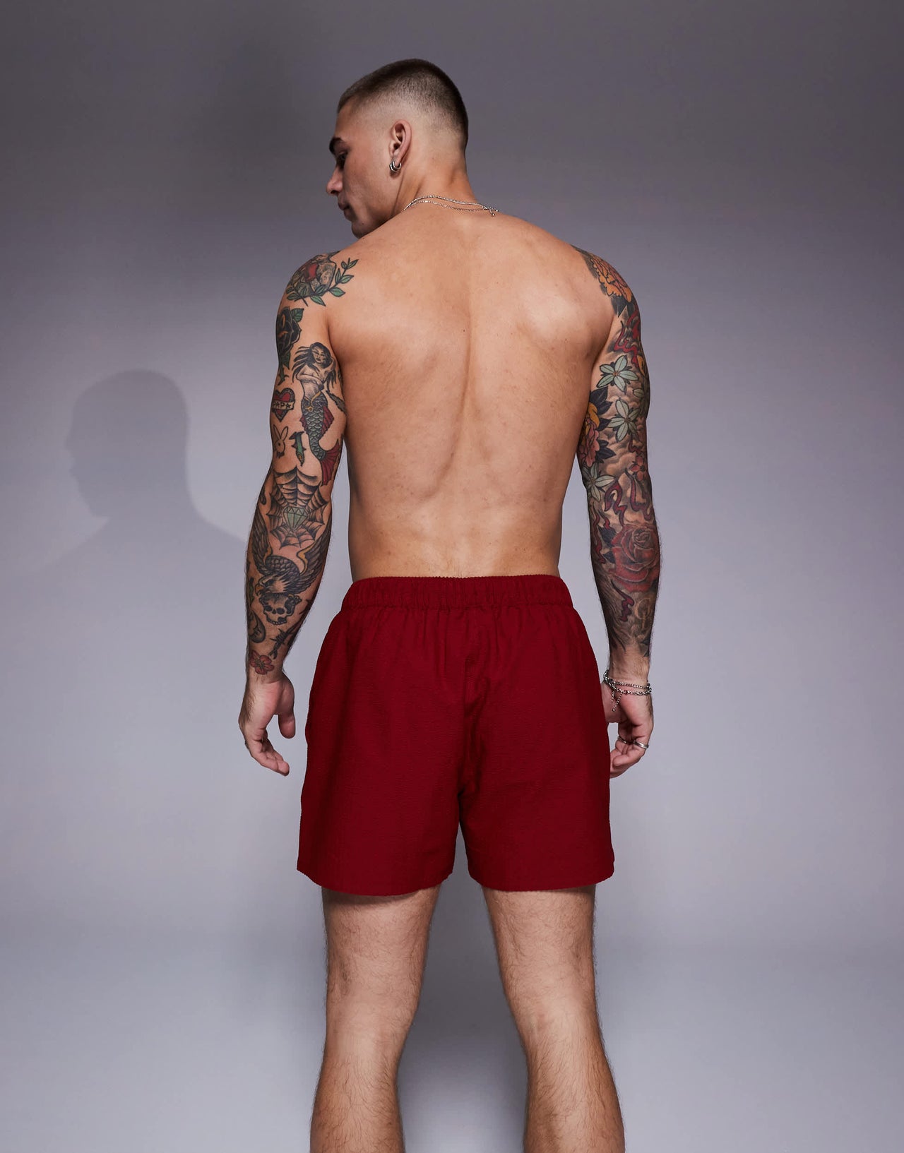 ASOS DESIGN seersucker swim shorts in short length in burgundy
