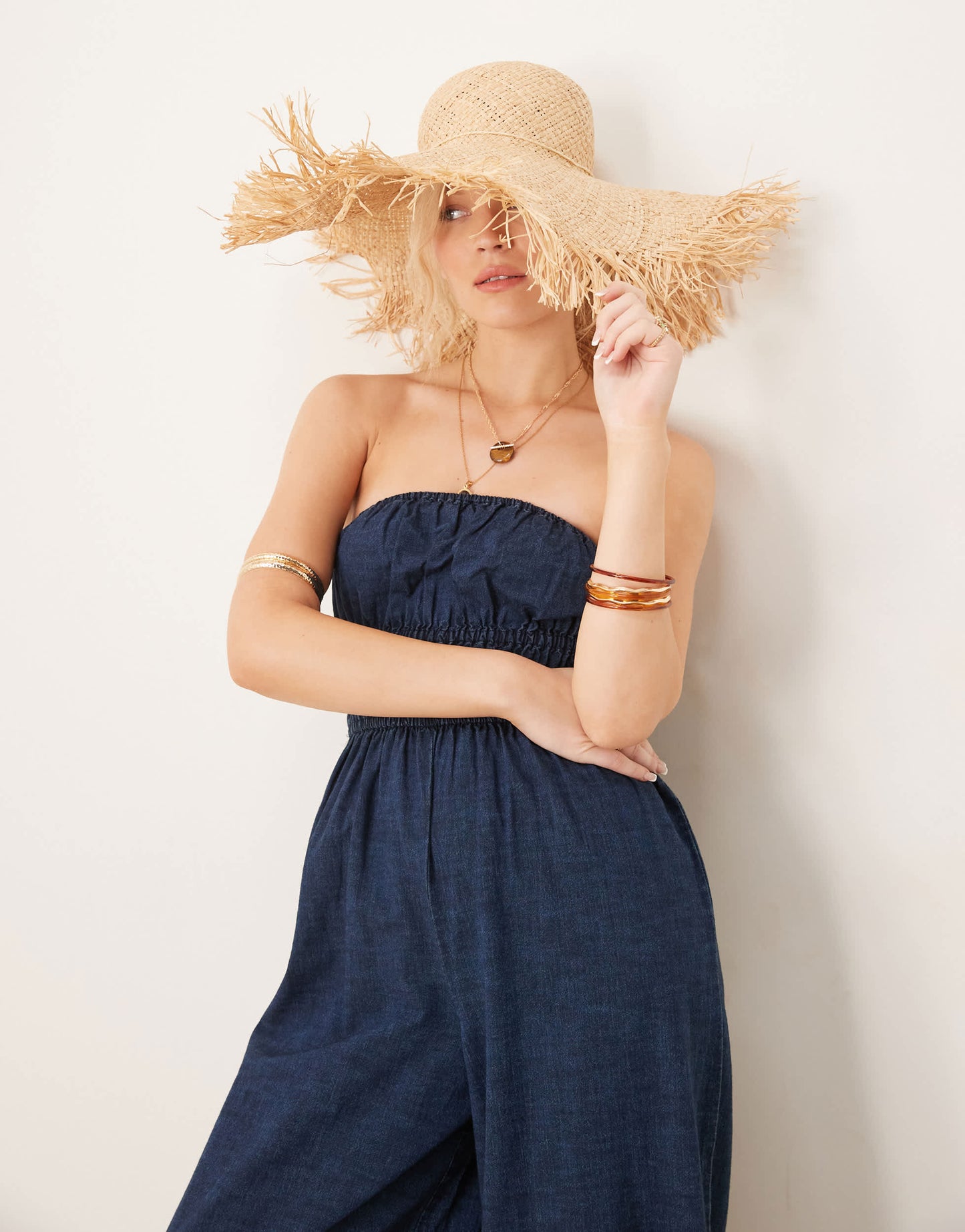 ASOS DESIGN soft denim strapless wide leg jumpsuit with shirring waist in rinse wash