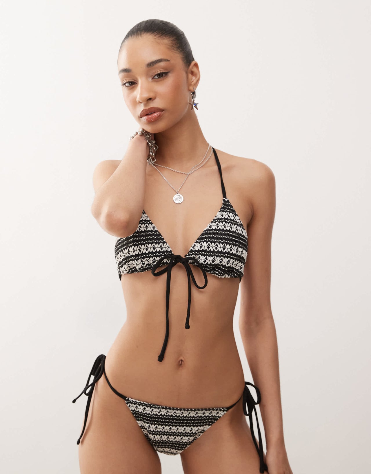Reclaimed Vintage tie front triangle bikini top in black and white crochet