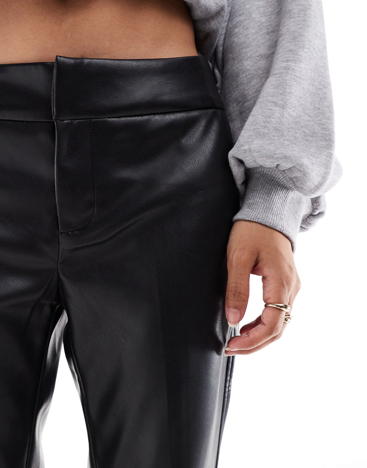Bershka Petite faux leather flared trousers in black