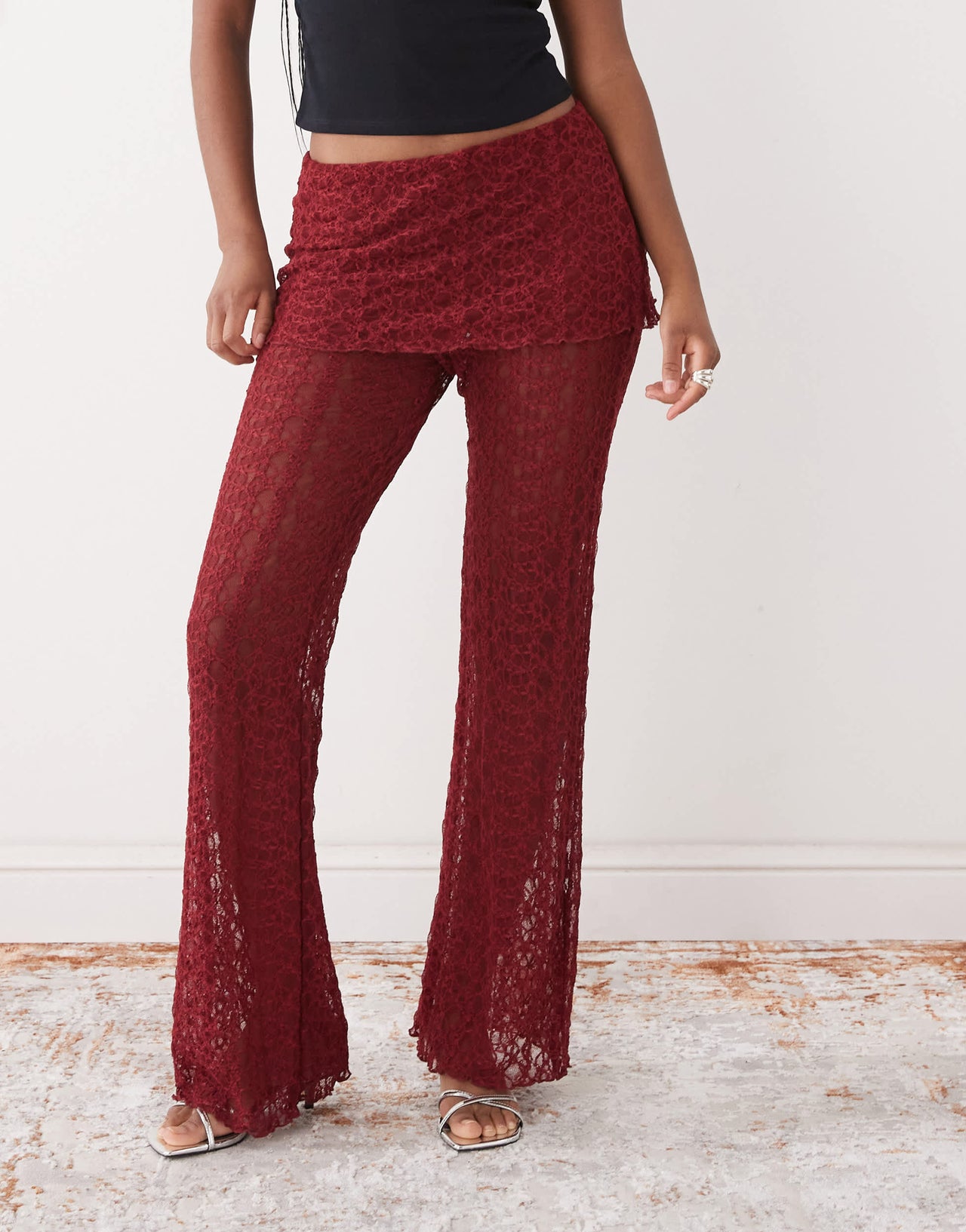 Noisy May lace skirt over trousers in dark red