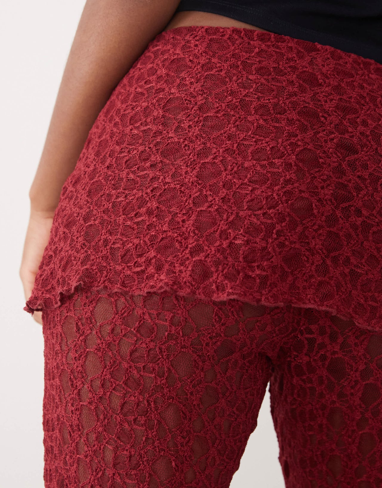 Noisy May lace skirt over trousers in dark red