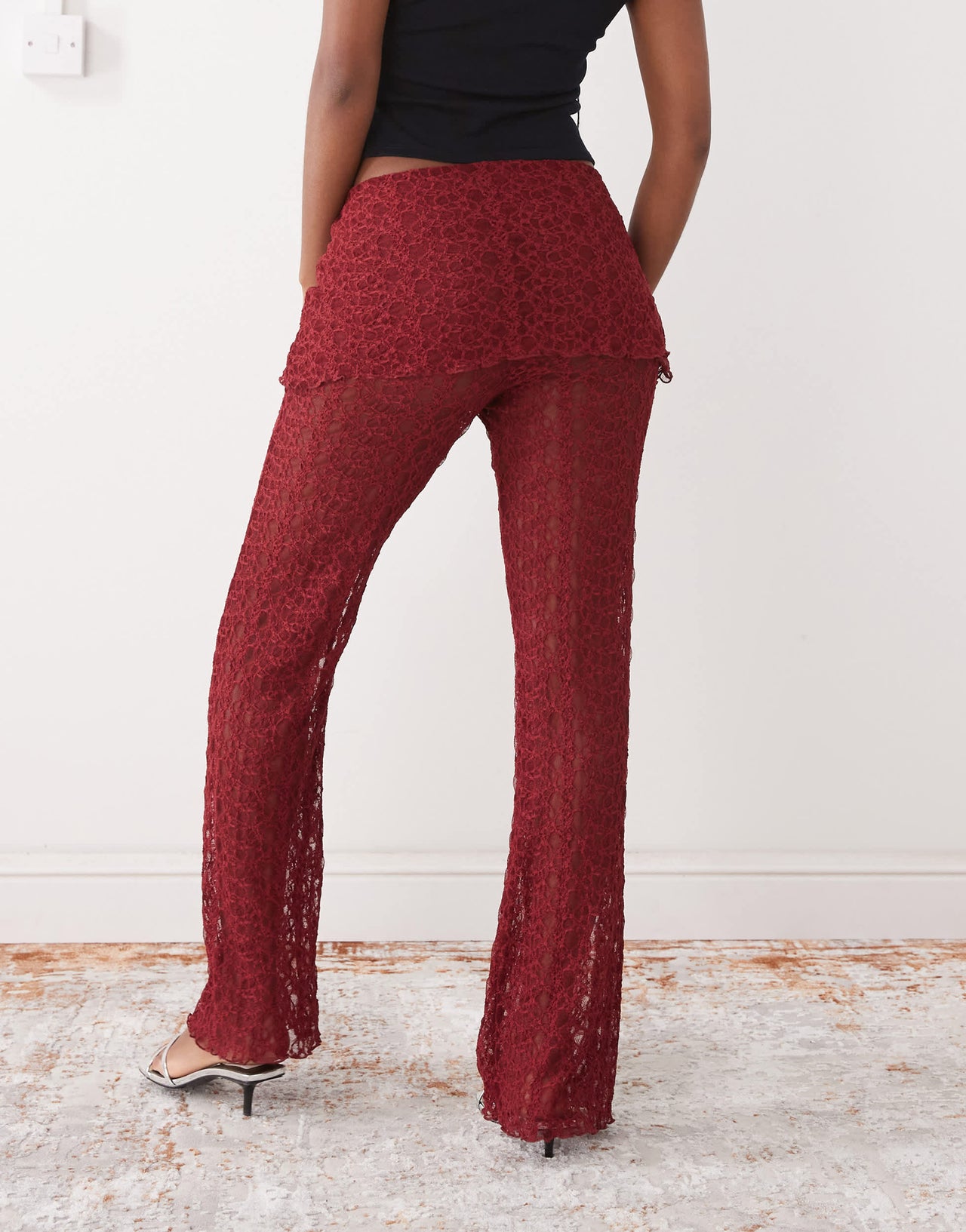 Noisy May lace skirt over trousers in dark red
