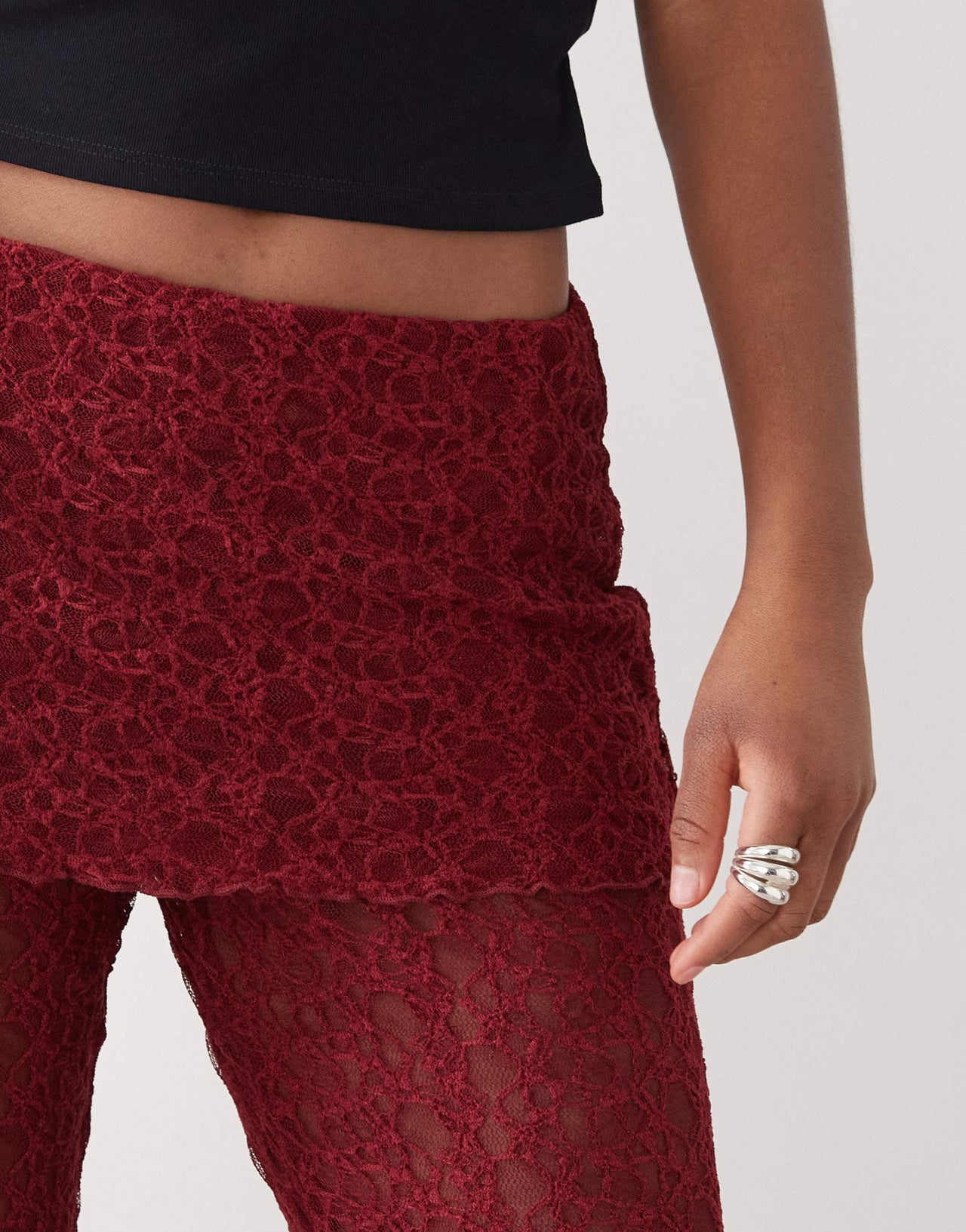 Noisy May lace skirt over trousers in dark red