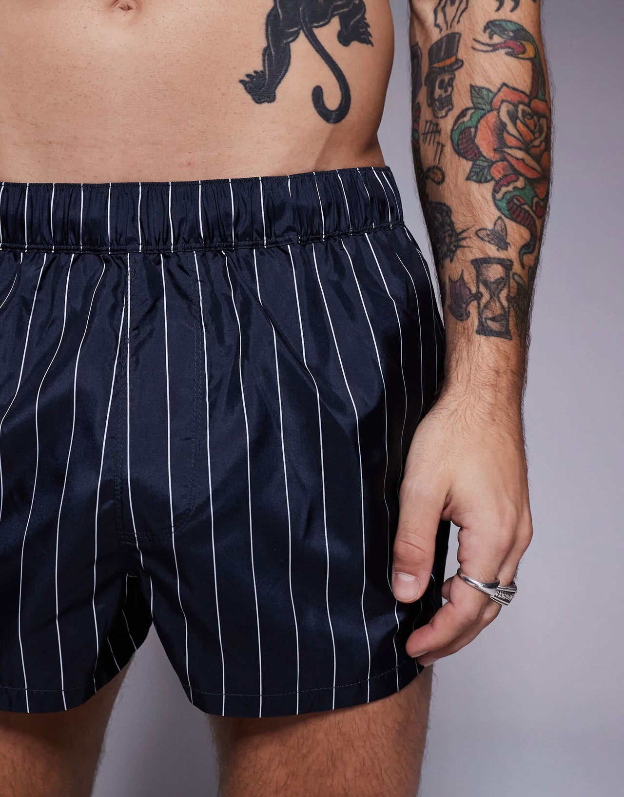 ASOS DESIGN swim short in super short length in navy and white pin stripe