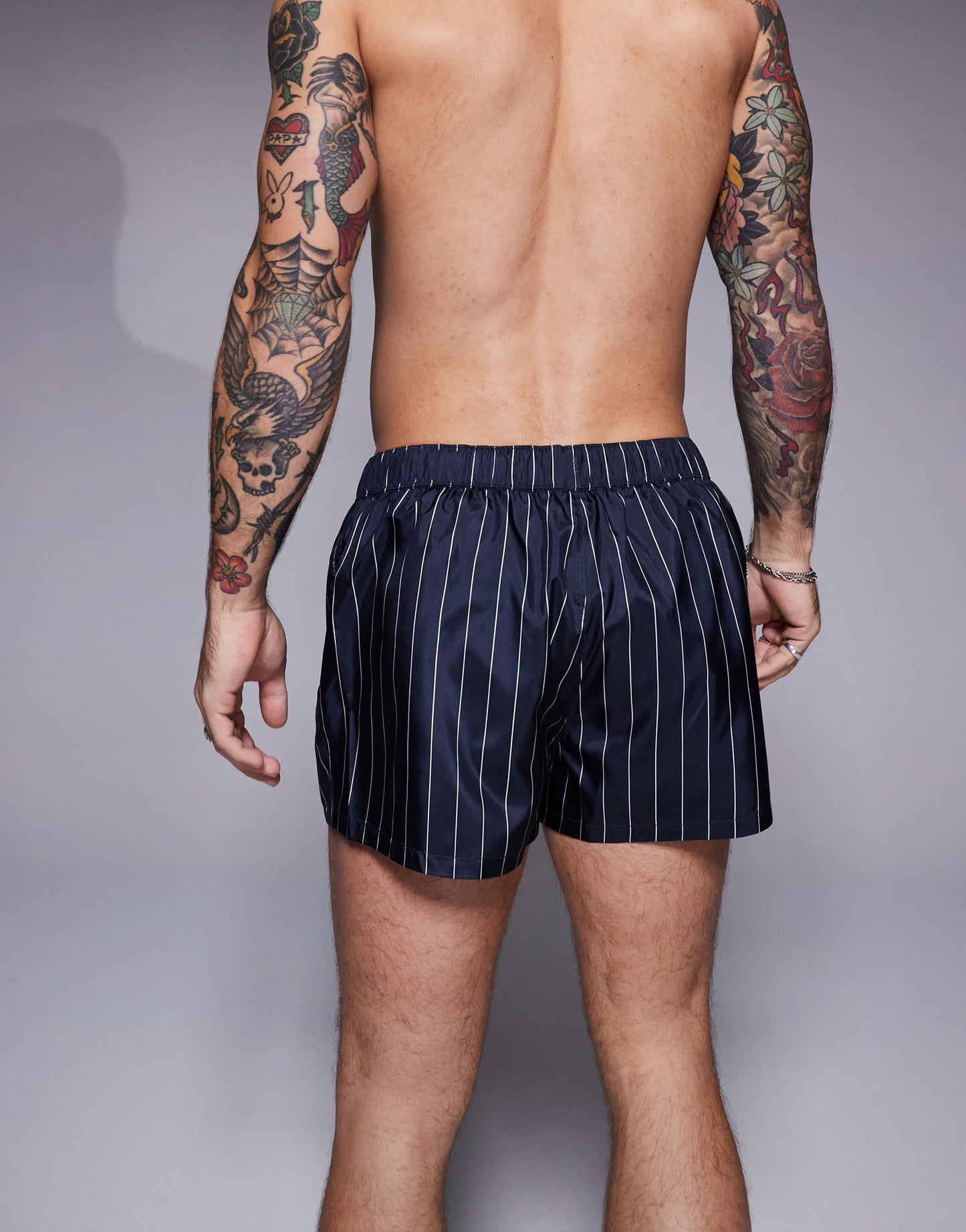 ASOS DESIGN swim short in super short length in navy and white pin stripe