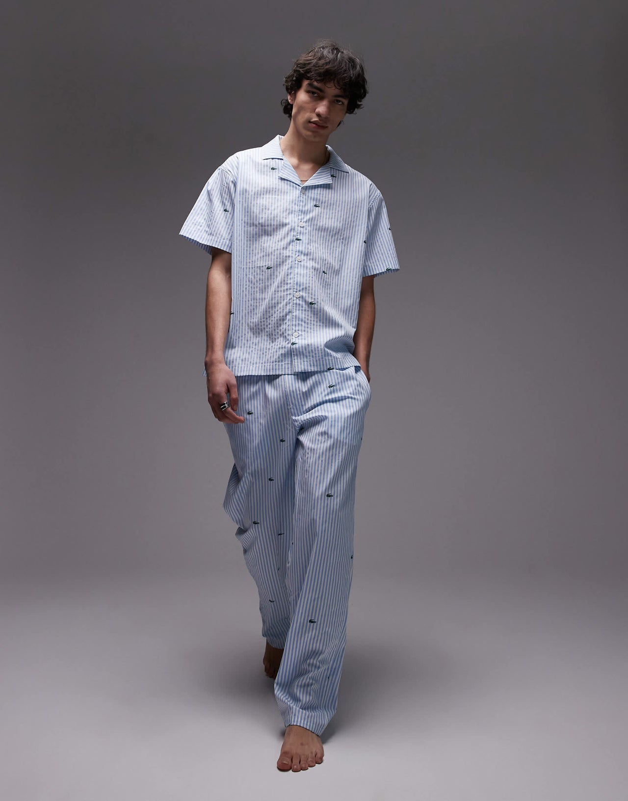 Lacoste loungewear trousers in light blue with all over croc print