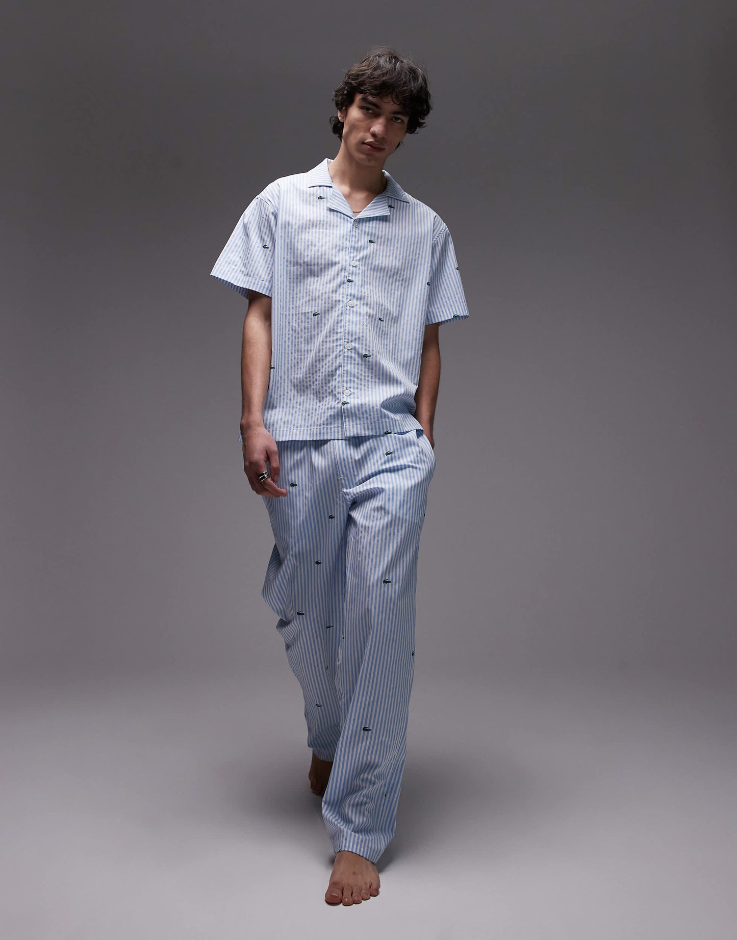 Lacoste loungewear trousers in light blue with all over croc print