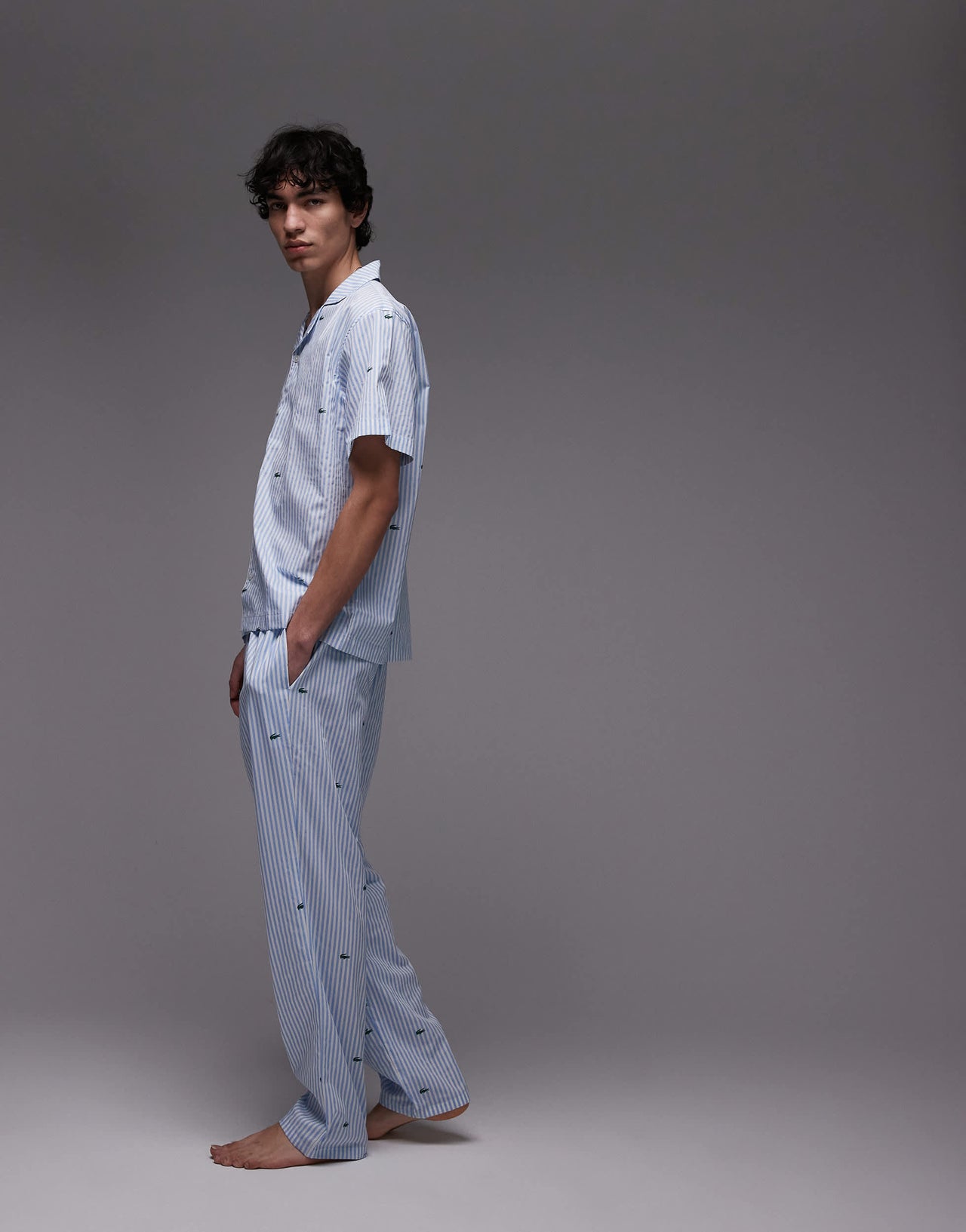 Lacoste loungewear trousers in light blue with all over croc print